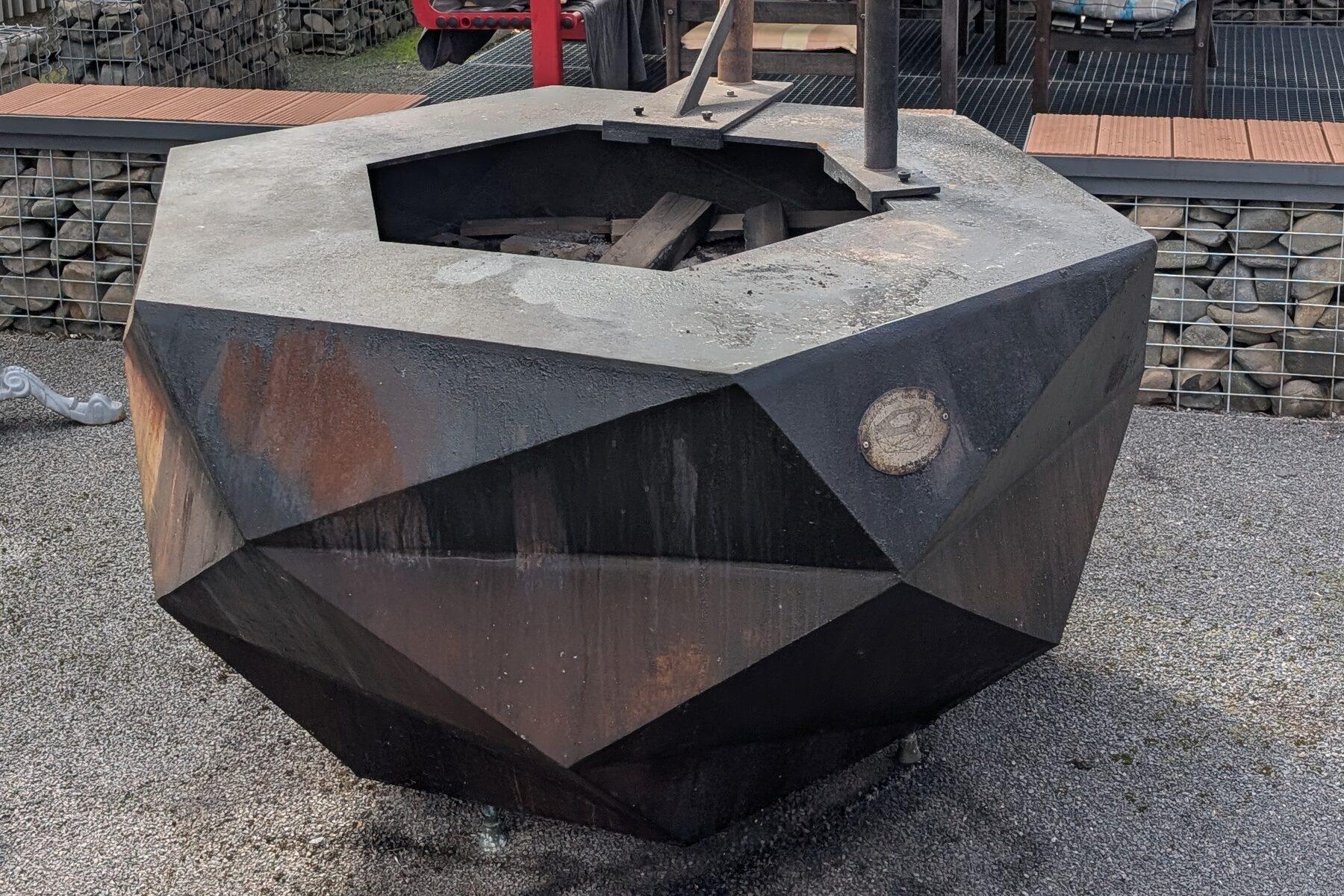 Blackened finish: dark matte faceted surfaces marked by fire