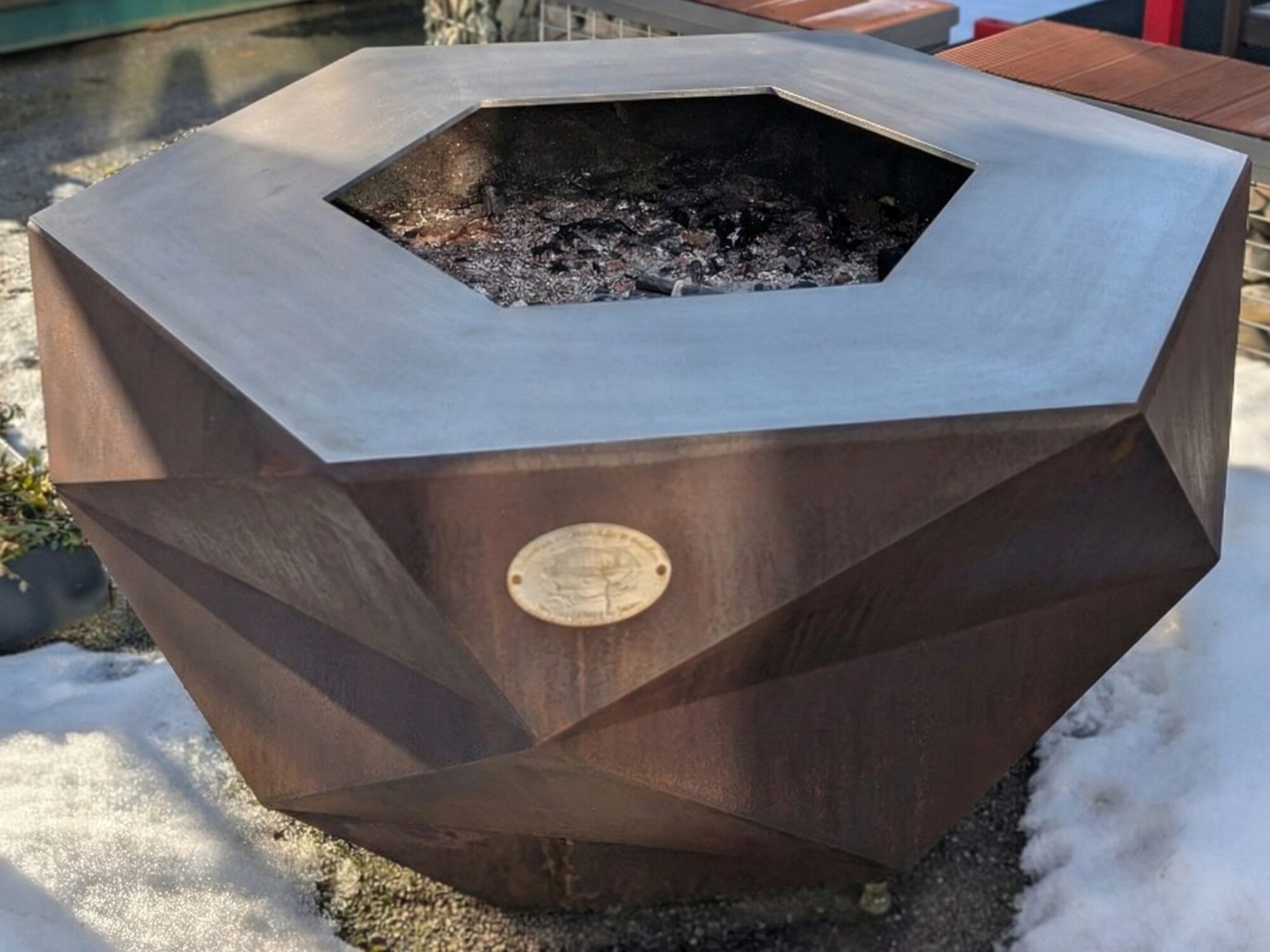 Iron Icon fire bowl with corten patina, hexagonal fire opening and stainless steel rim